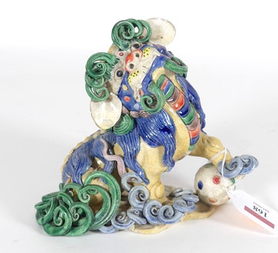 Lot 168 - A Chinese polychrome glazed pottery foo dog,...