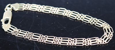 Lot 394 - A 9ct gold gatelink bracelet with lobster claw...