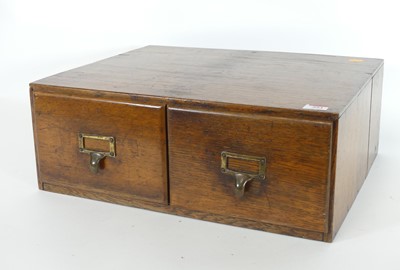 Lot 553 - An early 20th century oak two drawer file...