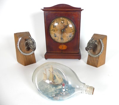Lot 556 - An early 20th century American mantel clock, h....