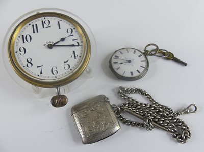Lot 423 - A vintage nickel cased 8-day car clock, having...