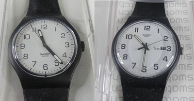 Lot 432 - Two boxed Swatch fashion watches; together...