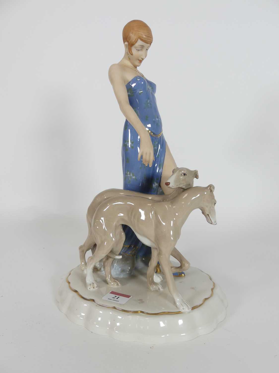 Lot 21 - A Royal Dux porcelain figure, of a lady...