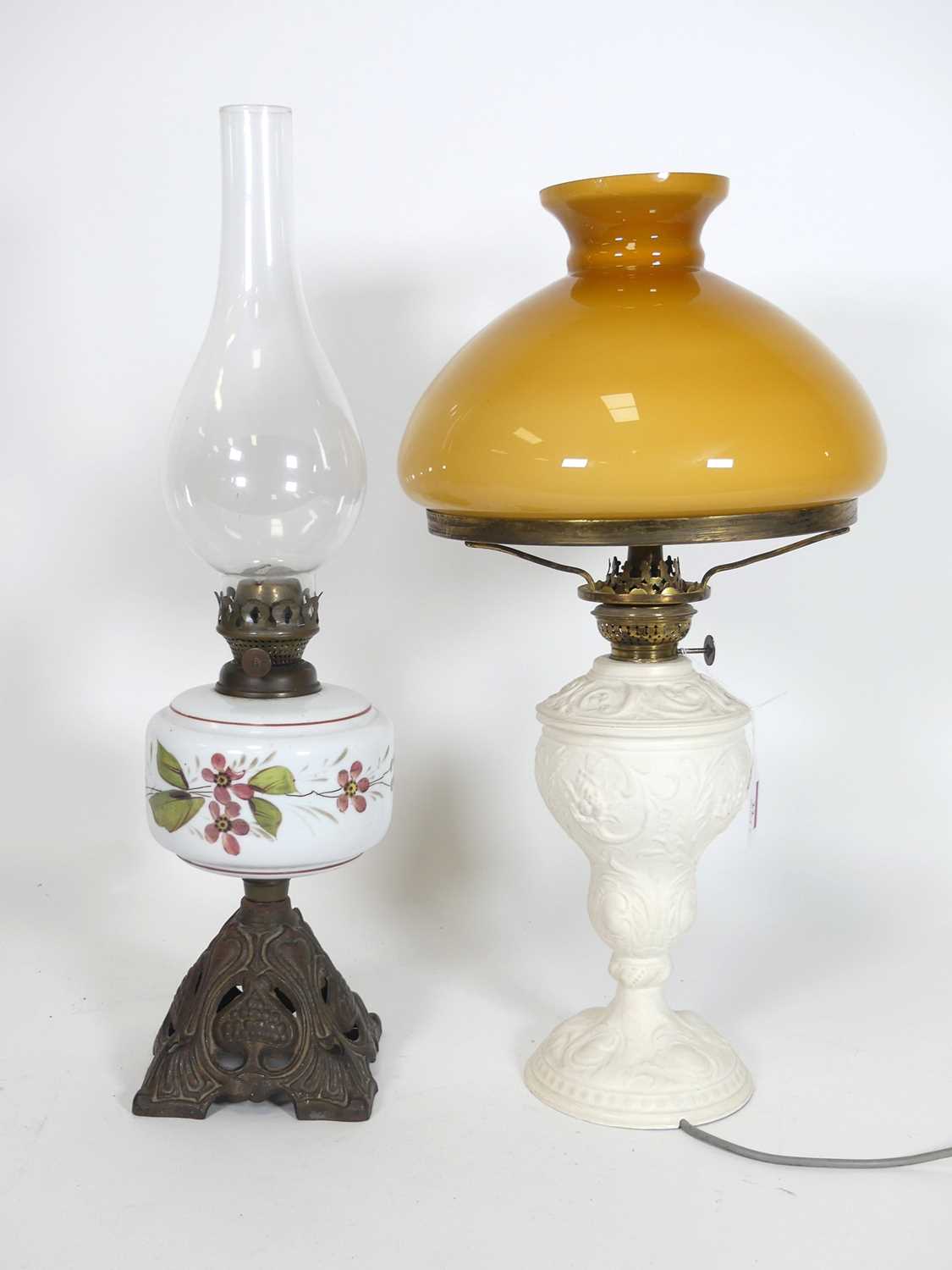 Lot 22 - A late 19th century oil lamp having an opaline...