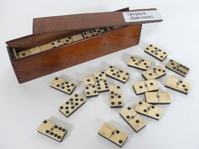 Lot 465 - A part set of bone and stained wooden dominoes