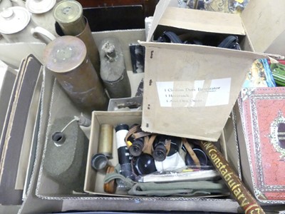 Lot 570 - A collection of militaria, to include a gas...