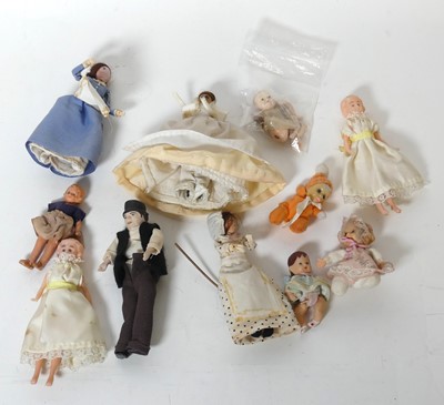 Lot 297 - A collection of miniature dolls, 20th century,...