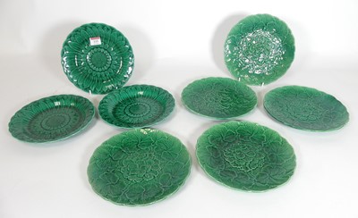 Lot 115 - A group of eight green glazed majolica plates,...