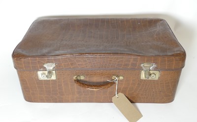 Lot 591 - A faux crocodile skin suitcase, width 58 c.m.
