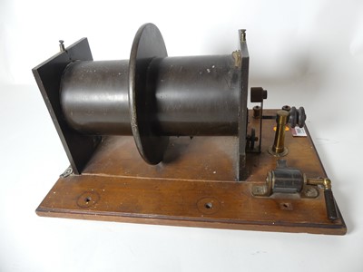 Lot 585 - A Ruhmkororff induction coil, having mahogony...