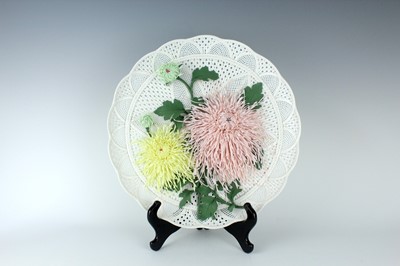 Lot 219 - A Chinese porcelain sculptured chrysanthemum...