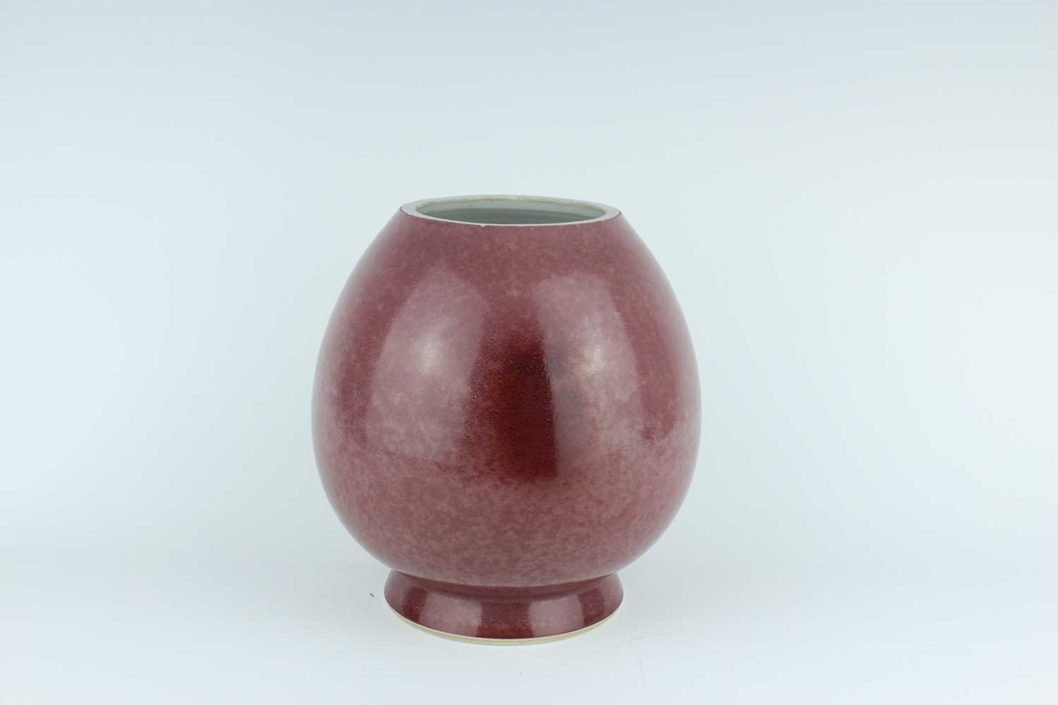 Lot 90 - A Chinese peach bloom-glazed jar, Xiafeng mark...