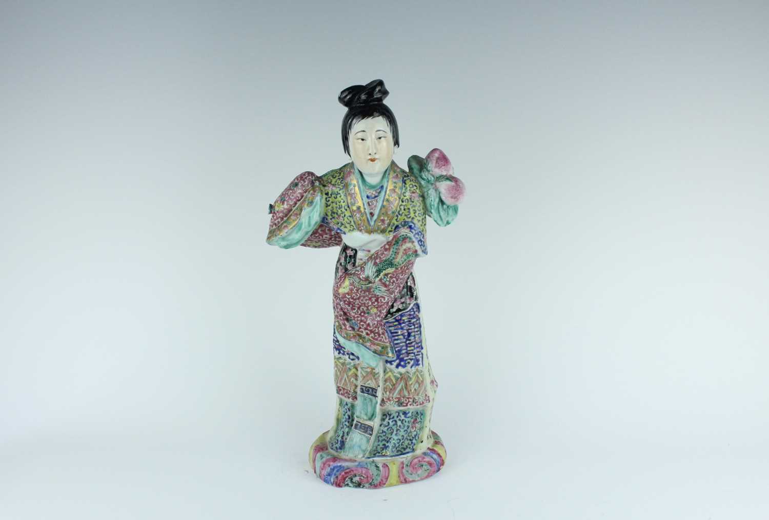 Lot 131 - A Chinese famille rose figure of a lady...
