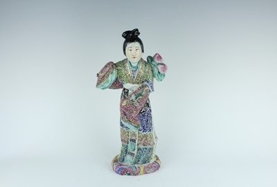 Lot 131 - A Chinese famille rose figure of a lady...