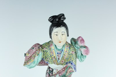 Lot 131 - A Chinese famille rose figure of a lady...