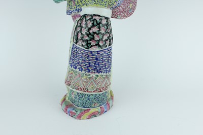 Lot 131 - A Chinese famille rose figure of a lady...