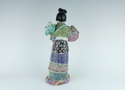 Lot 131 - A Chinese famille rose figure of a lady...