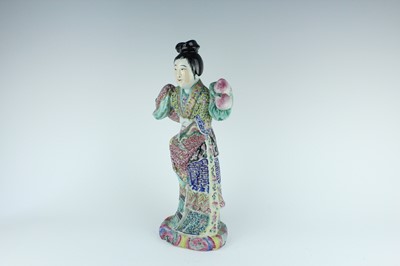 Lot 131 - A Chinese famille rose figure of a lady...