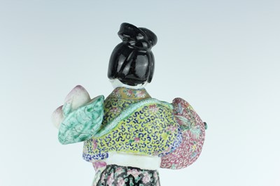 Lot 131 - A Chinese famille rose figure of a lady...