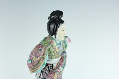Lot 131 - A Chinese famille rose figure of a lady...