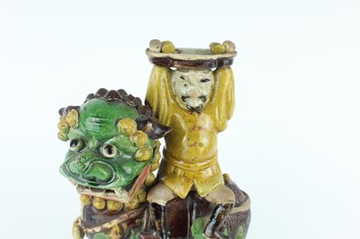Lot 129 - Three Chinese sancai-glazed figures, Qing...