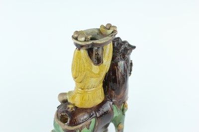 Lot 129 - Three Chinese sancai-glazed figures, Qing...