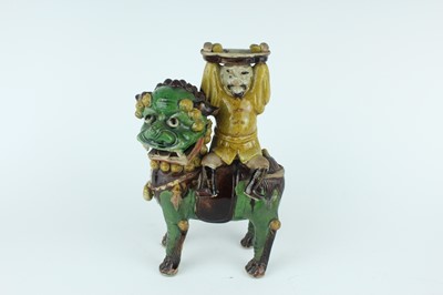Lot 129 - Three Chinese sancai-glazed figures, Qing...
