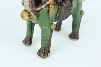 Lot 129 - Three Chinese sancai-glazed figures, Qing...