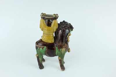 Lot 129 - Three Chinese sancai-glazed figures, Qing...