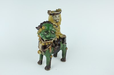 Lot 129 - Three Chinese sancai-glazed figures, Qing...