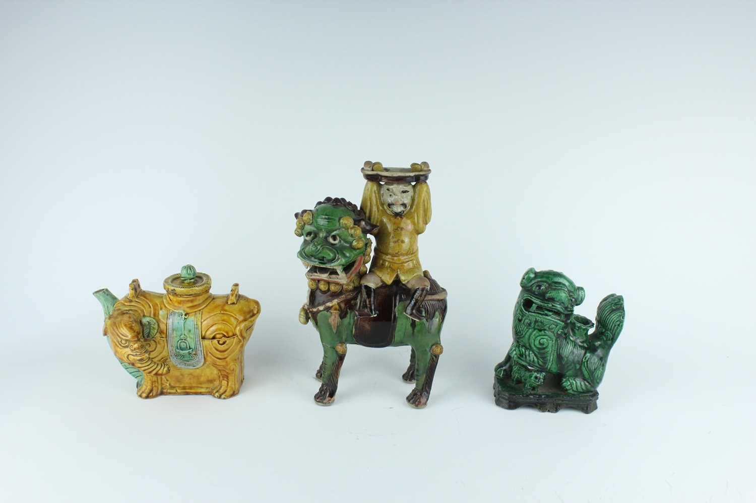 Lot 129 - Three Chinese sancai-glazed figures, Qing...