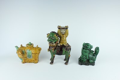 Lot 129 - Three Chinese sancai-glazed figures, Qing...