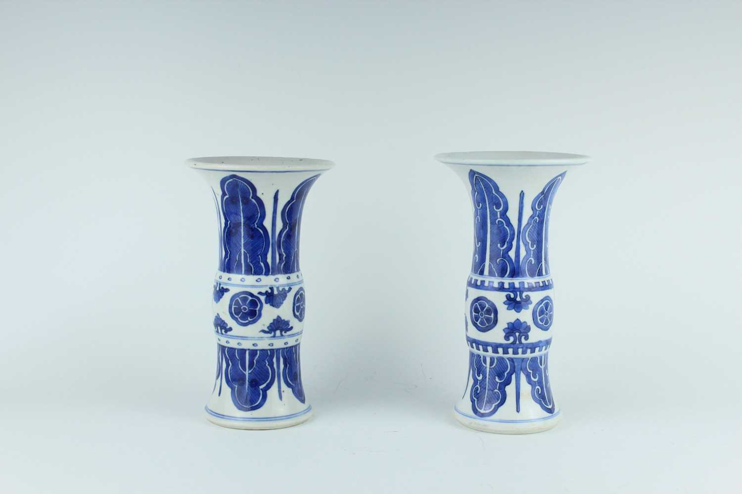 Lot 22 - A pair of Chinese blue and white gu vases,...