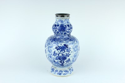 Lot 19 - A Chinese blue and white gourd vase, Qing...