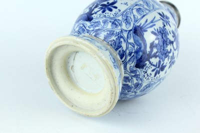 Lot 19 - A Chinese blue and white gourd vase, Qing...