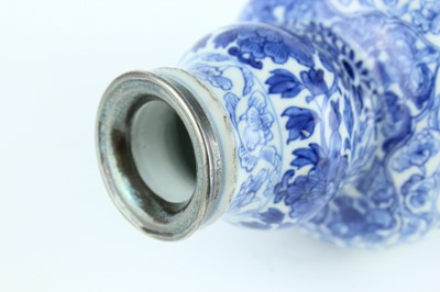 Lot 19 - A Chinese blue and white gourd vase, Qing...