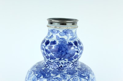 Lot 19 - A Chinese blue and white gourd vase, Qing...