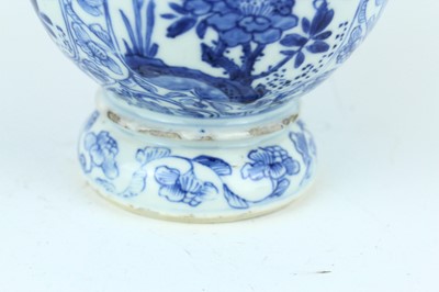 Lot 19 - A Chinese blue and white gourd vase, Qing...