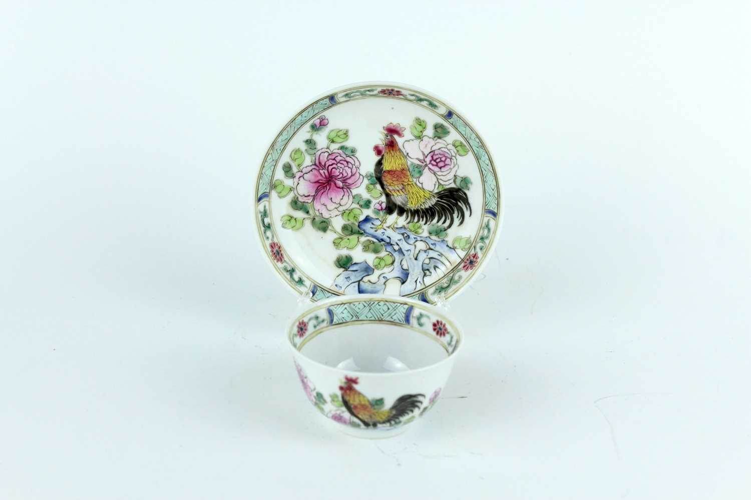 Lot 193 - A Chinese famille rose tea bowl and saucer,...