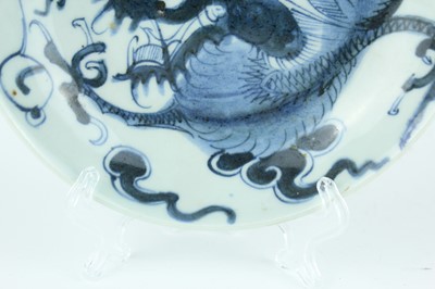 Lot 10 - A Chinese blue and white ‘dragon’ dish, Qing...