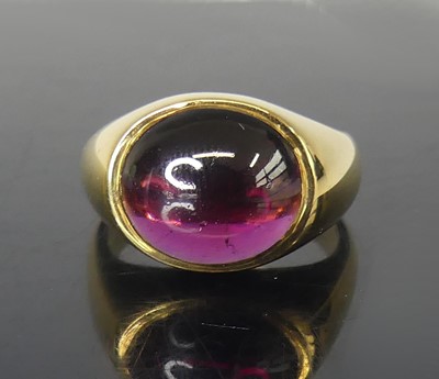 Lot 2545 - An 18ct yellow gold and garnet signet ring,...