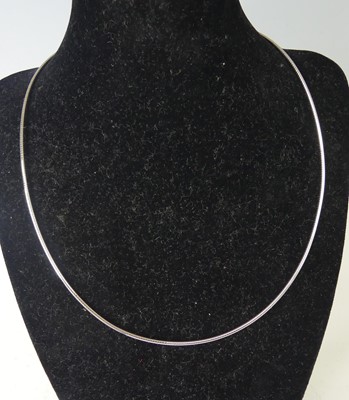 Lot 2556 - An 18ct white gold Omega wire necklet with...