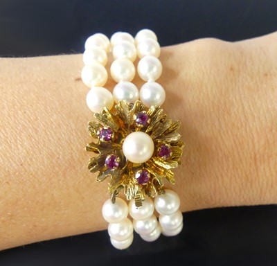 Lot 2513 - A three-row cultured Akoya pearl bracelet,...