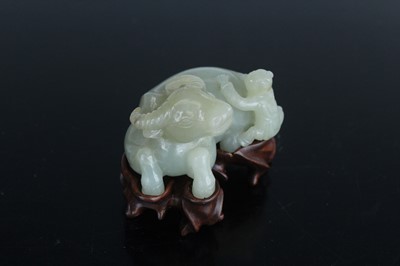 Lot 38 - A Chinese pale celadon jade figure of a water...