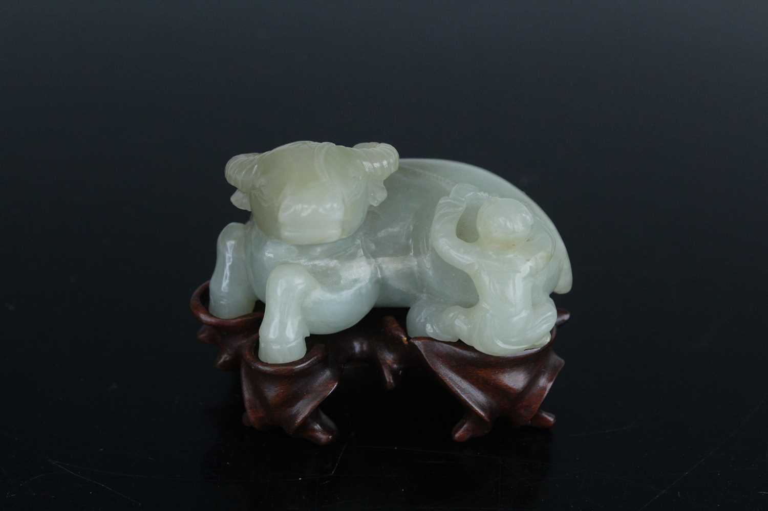Lot 38 - A Chinese pale celadon jade figure of a water...