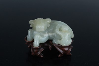 Lot 38 - A Chinese pale celadon jade figure of a water...