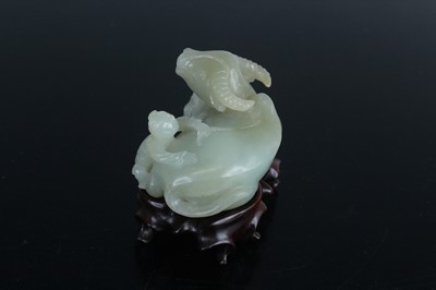 Lot 38 - A Chinese pale celadon jade figure of a water...
