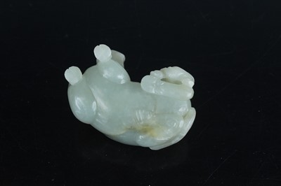 Lot 38 - A Chinese pale celadon jade figure of a water...