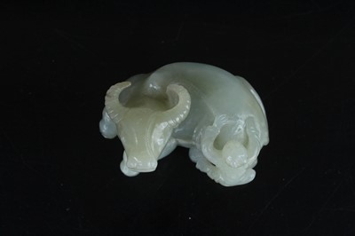 Lot 38 - A Chinese pale celadon jade figure of a water...