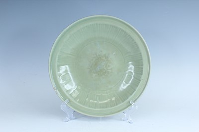 Lot 99 - A Chinese Longquan celadon dish, early Ming...